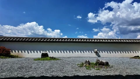 Time Lapse Clouds Drifting Over Japanese Zen Garden Wall Under Blue Sky Stock Footage 340131507
