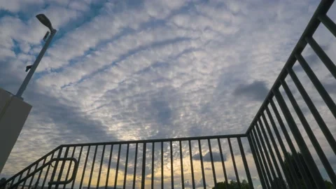 Time lapse of clouds during sunset Stock Footage