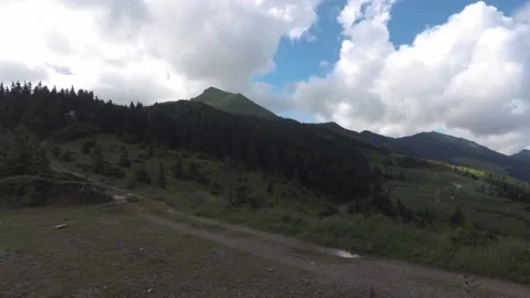 Time-lapse clouds envelop a large mountain Stock Footage 137921982