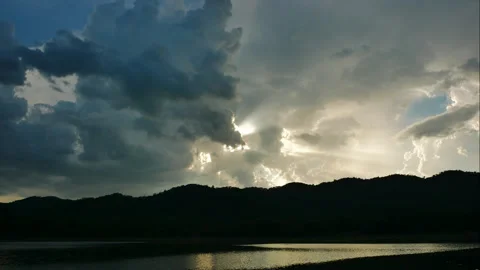Time-lapse of Clouds fast in the sky and sunset on a large natural Stock Footage 246499446
