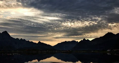 Time lapse, clouds float over the sea and mountains at night Stock Footage 122719850