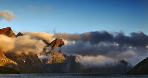 Time lapse, clouds float over the sea and mountains on a sunny day Stock Footage 122719861