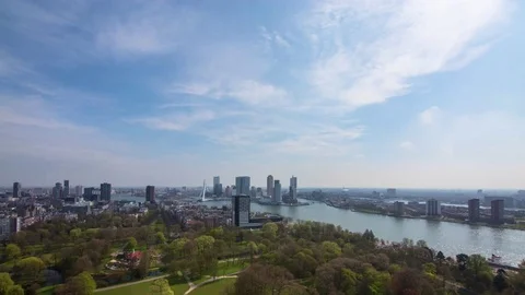 Time-lapse of clouds floating over cityscape and ship sailing in sea Stock Footage 81543732