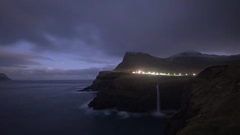 Time-lapse of clouds floating over ocean and cliffs at dusk Stock Footage 116599434