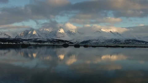 Time-lapse of clouds floating over the snowy mountains Stock Footage 116787516