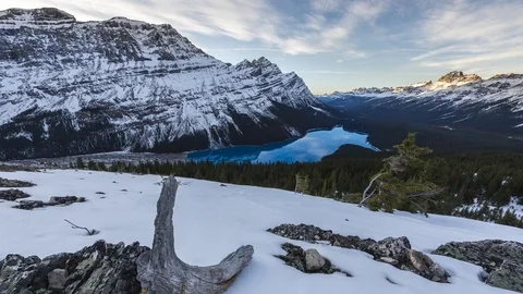 Time lapse clouds flowing above Peyto Lake on a snowy winter day Stock Footage 85372372