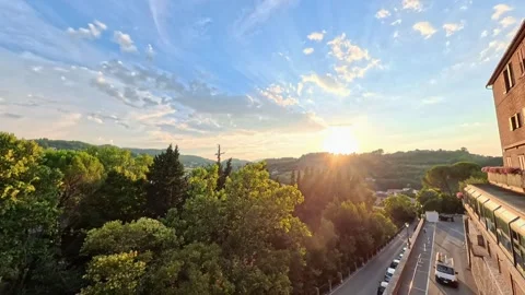 Time lapse of clouds flowing above Spoleto, Umbria, Italy - Sunset Stock Footage 338347500