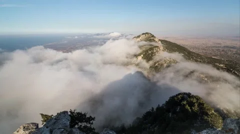 Time Lapse of Clouds Flowing over Besparmak Mountain in Kyrenia, Northern Cyprus Stock Footage 65766650