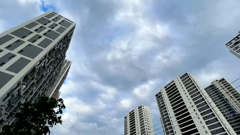 Time lapse of clouds flowing over the city on an overcast day Stock Footage 273534570
