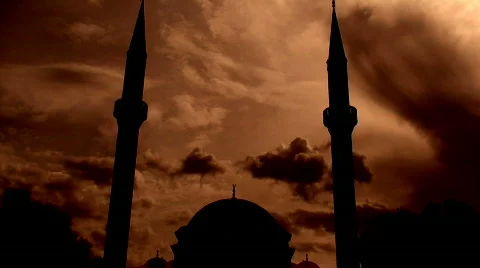 Time lapse clouds flowing past twin minaret mosque 4 Stock Footage 573687