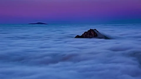 Time Lapse of Clouds Flowing Like Sea in Foggy Mountains at Blue Hour Sunset Stock Footage 311451533
