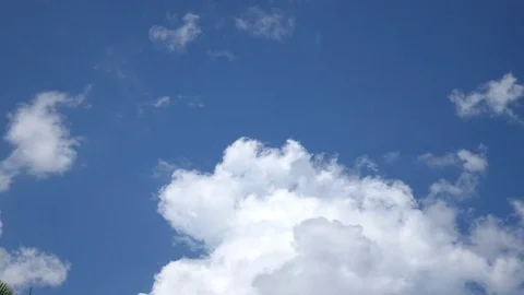 Time Lapse Clouds Flowing Through Blue Sky Stock Footage 77037434