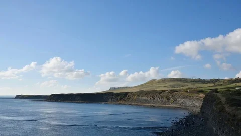 Time lapse of clouds forming and moving over cliffs Stock Footage 69894472
