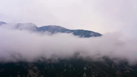 Time lapse. Clouds forming and moving against the mountain. Stock Footage 108978965