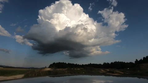 Time lapse of clouds forming over countryside land Stock Footage 136532179