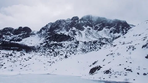 Time lapse of a clouds with frozen lake at the bottom of a mountain Stock Footage 85225464