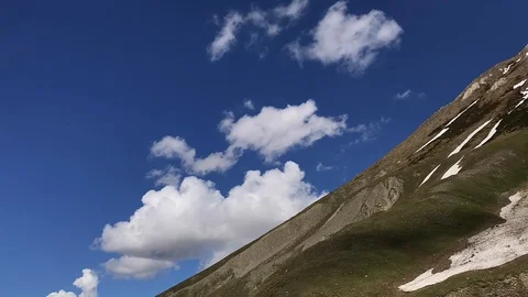 Time-lapse of clouds go over mountainside. Cloudy sky, Georgia. Caucasus. Stock-Footage 115530219