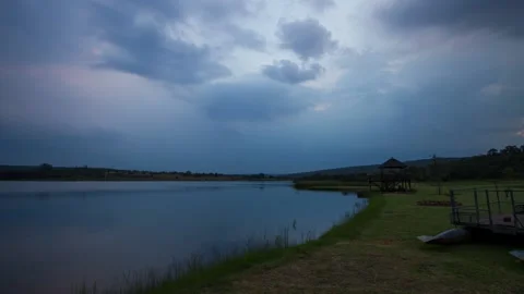 Time lapse of clouds going across a dam in blue hour until dark Stock Footage 152905580