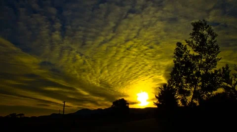 Time Lapse of clouds with golden sunlight. Stock Footage 65564805