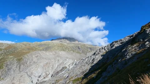 Time lapse of clouds hanging on a mountain peak in the swiss alps Stock Footage 209136744