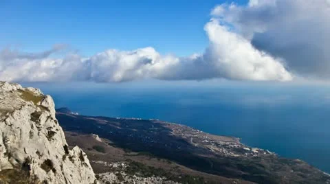 Time Lapse Clouds - HD. Over sea and rock Stock Footage 22096772