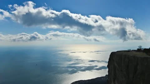 Time Lapse Clouds - HD. Over sea and rock Stock Footage 22096788