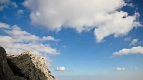 Time Lapse Clouds - HD. Over sea and rock Stock Footage 22096917
