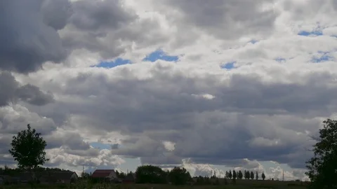 Time lapse clouds with houses Stock-Footage 103817362