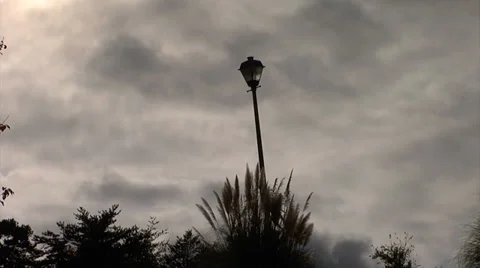 Time lapse of Clouds with a lamp post in the foreground Video stock 34484096
