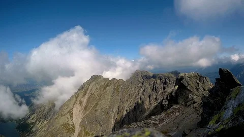 Time lapse of clouds mass rolling over mountain Rysy in Poland Stock Footage 82400098