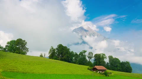 Time lapse clouds in motion covered mountain Video stock 44840098