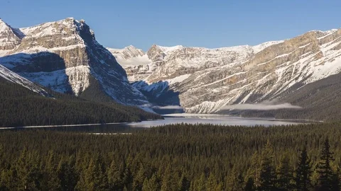 Time lapse clouds in a mountain valley above a lake Stock Footage 85415734