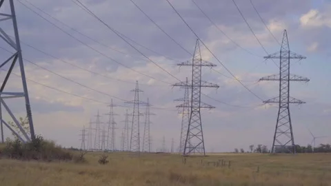 Time lapse. Clouds move  against the backdrop of high-voltage power lines Stock Footage 312069760