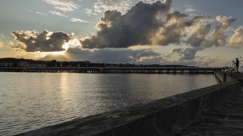 Time lapse of the clouds movement on the sky and boats on the sea. Video stock 110807879