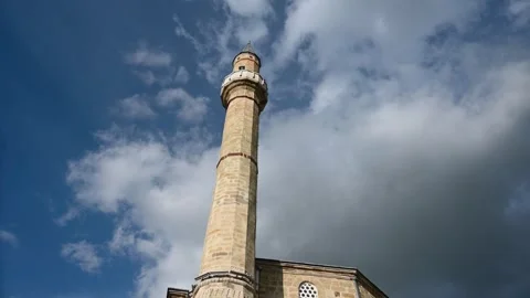 Time lapse of clouds moving about mosque and minaret. Symbol of Islam. Stock Footage 276137102