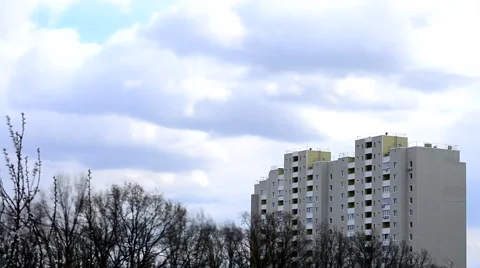 Time lapse of clouds moving above apartment block Stock Footage 49288174