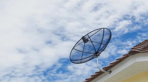 Time lapse of clouds moving above television sattelite dish.Telecomunications Stock Footage 61264271