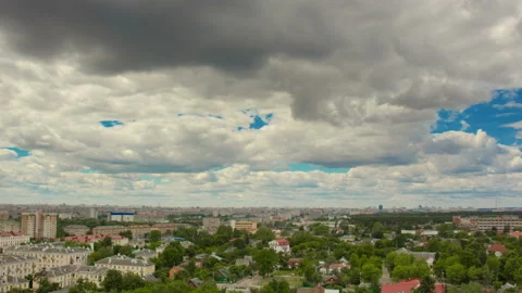 Time lapse of clouds moving above city 4k (4096x2304) Stock Footage 94185826