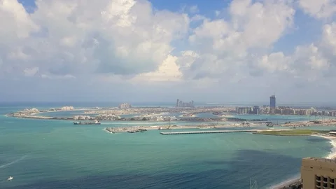Time lapse clouds moving above The Palm Jumeirah and Atlantis hotel Stock Footage 108579119