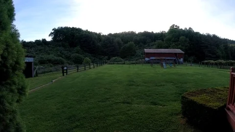 Time lapse of clouds moving above backyard Video stock 111067783