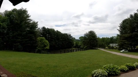 Time lapse of clouds moving above a ranch 2 Stock Footage 111067833