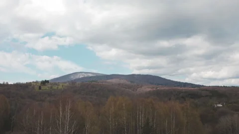 Time lapse of clouds moving above mountain range. Stockbeeldmateriaal 194792654