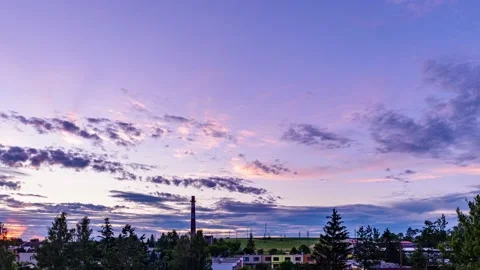 Time lapse, Clouds moving across sunset sky in small town Stock Footage 190896617