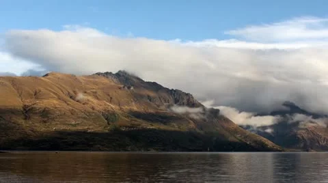 Time lapse of clouds moving around the mountains in Queenstown Stock Footage 11526350