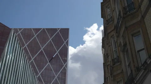 Time lapse. Clouds moving behind buildings. Stock Footage 114985776