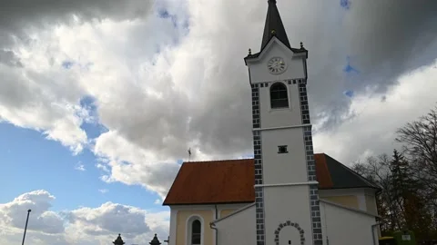 Time lapse of clouds moving behind catholic church Stock Footage 177417869