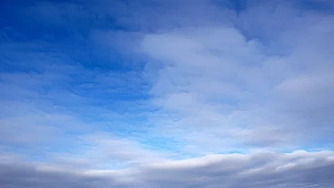 Time-lapse of Clouds Moving in Blue Sky Stock Footage 125397688