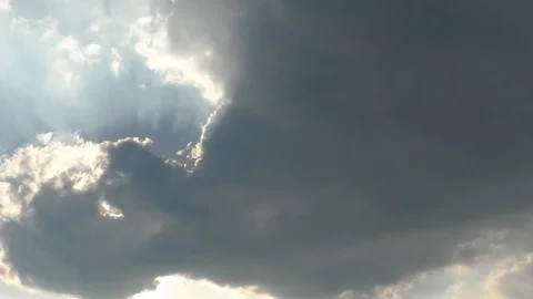 Time Lapse: Clouds moving in front of the rising sun, sunbeams, jet aircraft Stock Footage 90713990