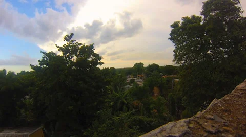 Time Lapse of Clouds Moving Over Dominican Village 스톡 동영상 34032386