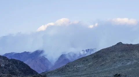 Time Lapse - Clouds moving over mountain Stock Footage 48106369